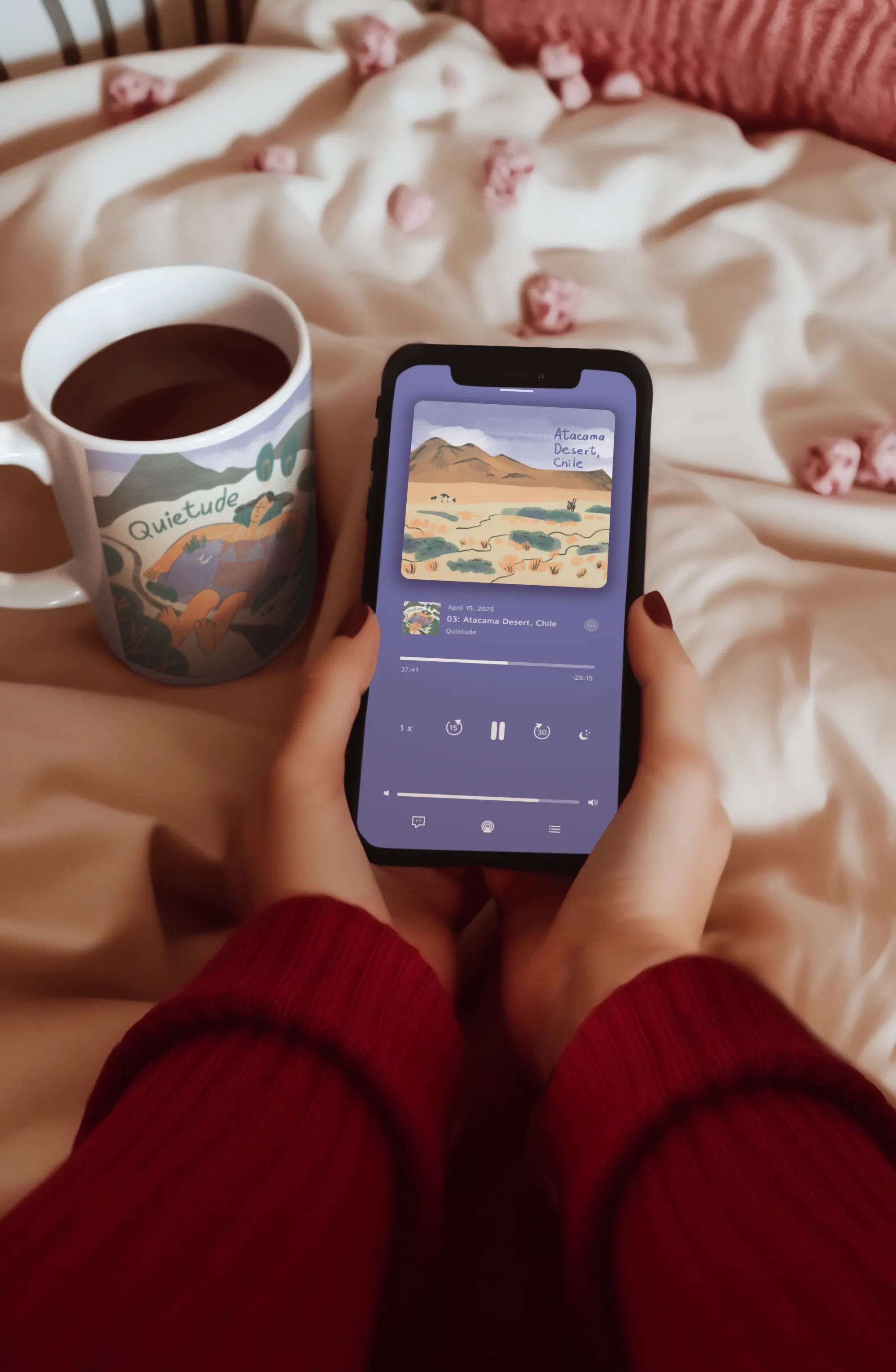 Hands holding phone with Quietude podcast playing